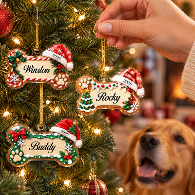 Personalized acrylic ornament dog name bone, hand holding Rocky ornament beside a golden retriever and lit tree