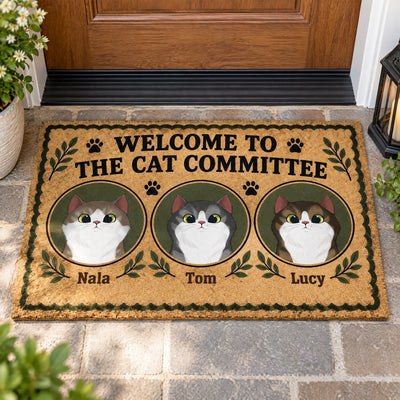 Personalized Cat Committee Doormat with three cat portraits named Nala, Tom and Lucy at a front door